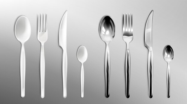 White plastic and steel cutlery on transparent