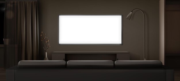 夜の暗いリビングルームの広い液晶テレビ画面