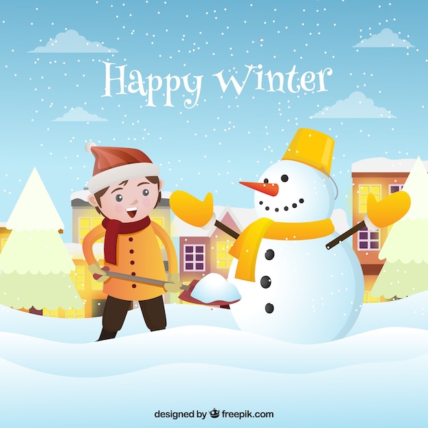 Winter background with a boy building a snowman