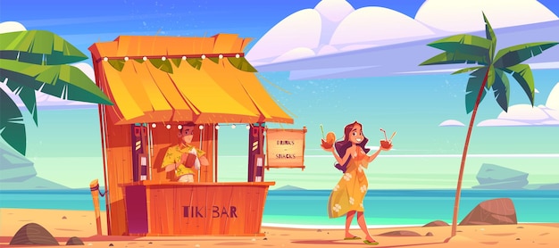 Woman buying cocktail in tiki hut bar with barman on hawaii beach