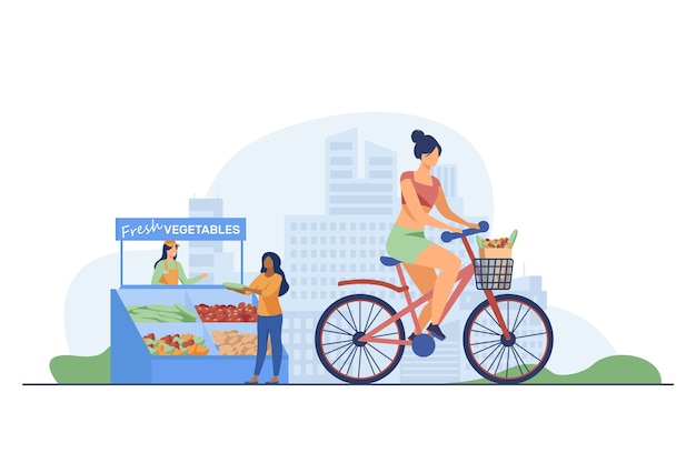 Woman cycling and buying fresh vegetables.