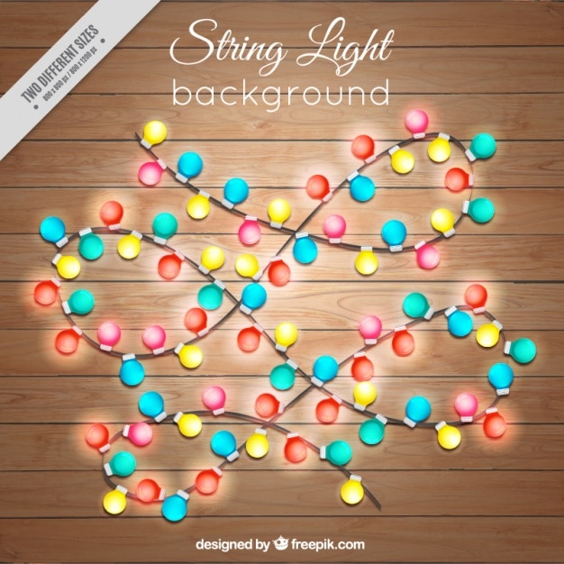 Free vector wooden background with garlands of lights