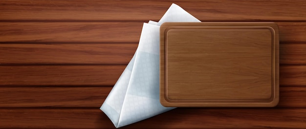 Wooden cutting board stand on kitchen napkin and wood table surface, top view