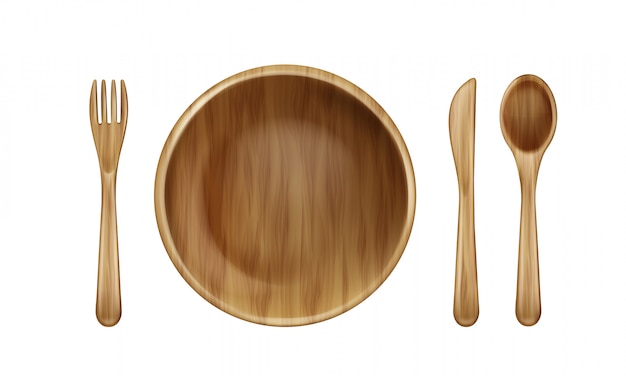 Wooden plate, fork, spoon and knife top view.