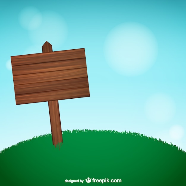 Wooden sign on grass