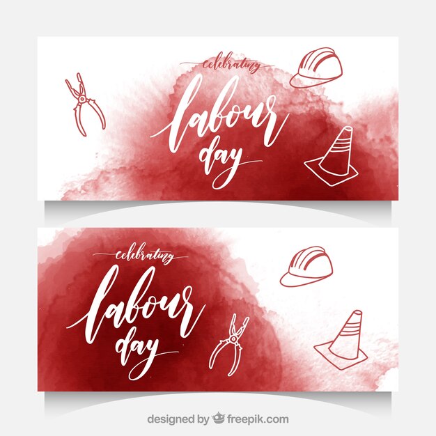 Worker's day banners with watercolor stains and tools