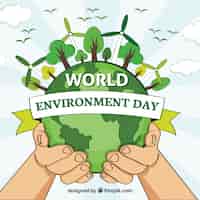 Free vector world environment day background with hands and windmill