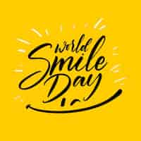 Free vector world smile day lettering with happy face