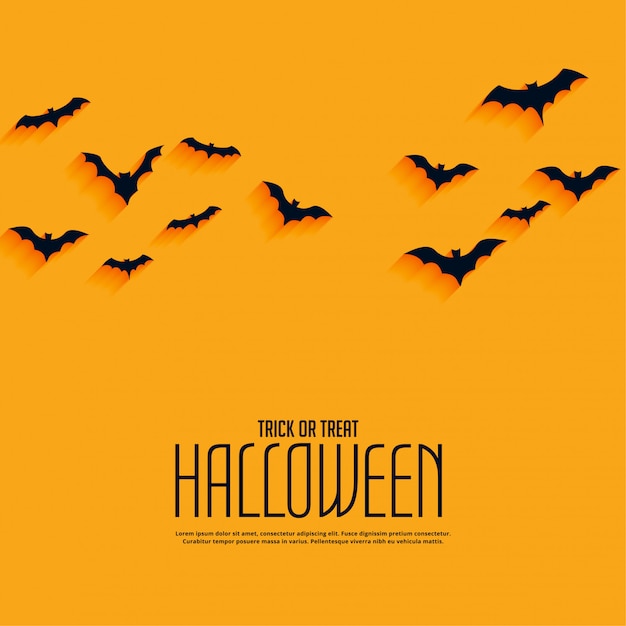 Yellow happy halloween background with flying bats