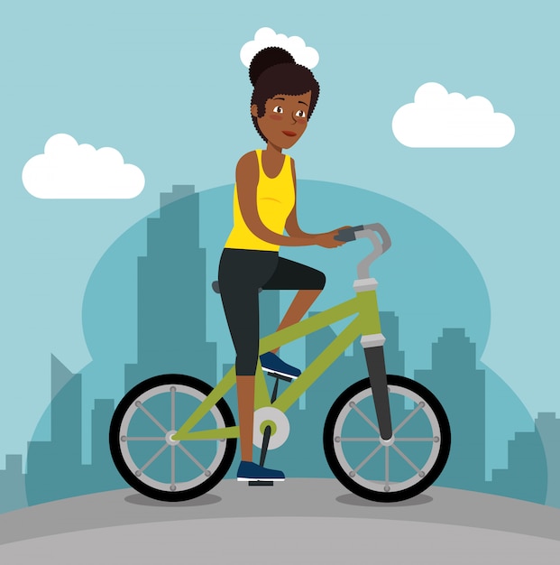 젊은 흑인 여자 승마 자전거