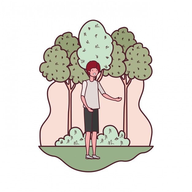 木々や植物のある風景の中の若い男