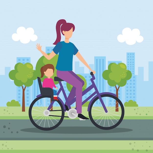 Young mother in bicycle with daughter in the park