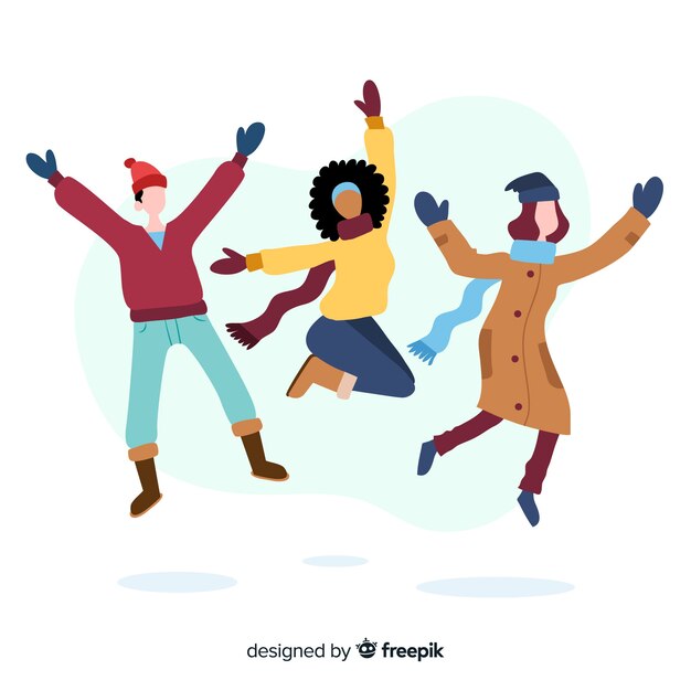 Young people wearing winter clothes jumping