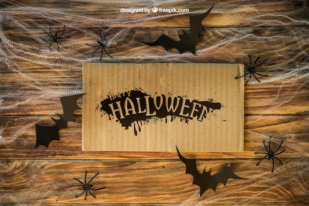 Halloween Mockup mit Karton auf Spinngewebe