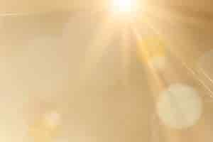 Kostenlose PSD natürliches licht lens flare psd auf goldenem hintergrund sonnenstrahleneffekt