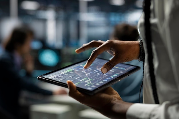Close up of data center computer scientist using tablet deploying servers and network hardware it