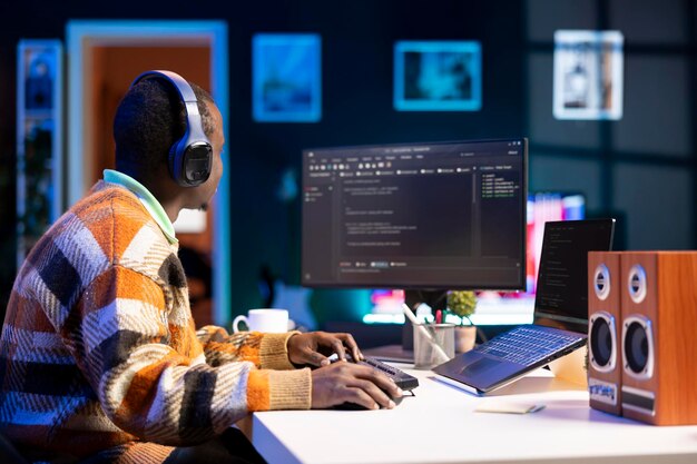 male programmer working on developing new html script