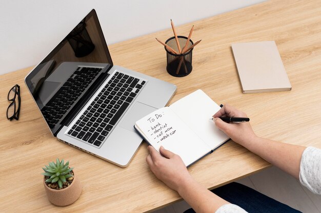 notebook with to do list on laptop