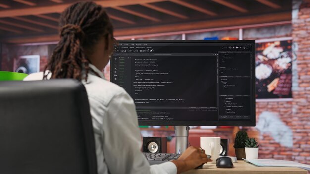 Programmer types code into PC entering commands running script