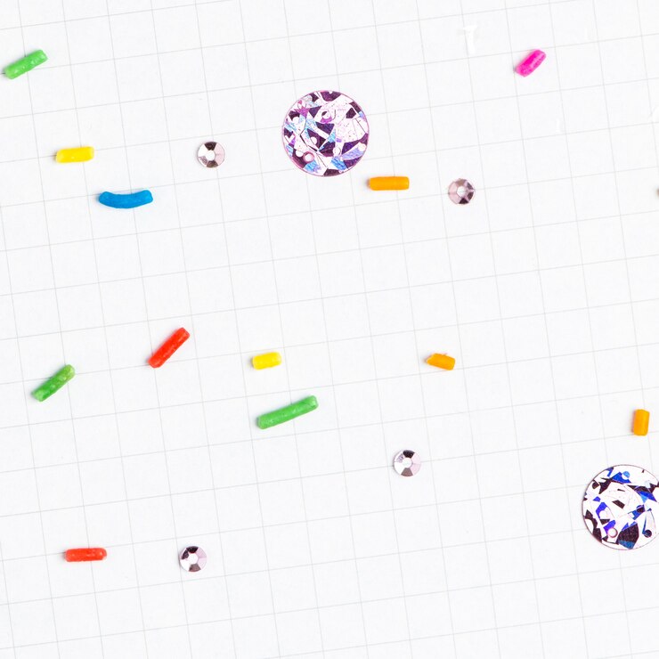 Gratis Foto sugar sprinkles white grid background