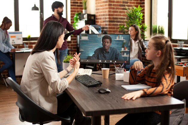 Working mother conducts online videocall