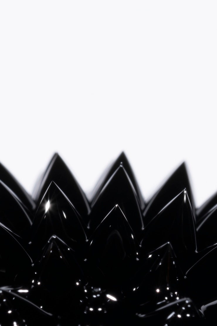 Gratis Bild close-up black ferromagnetic liquid metal with copy space