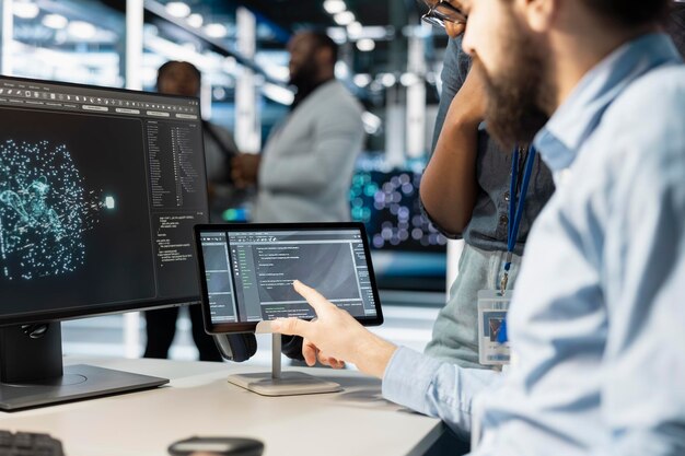 Close up of computer scientists in data center office using AI automation tools