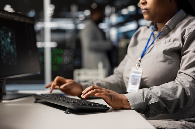 Close up of data center programmer coding writing script on PC