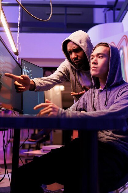 Confused hacker pointing at screen