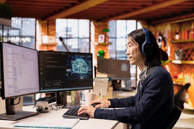 CTO manager listening music and coding in AI startup office