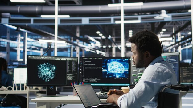 Data center computer scientist in wheelchair using AI node tree software