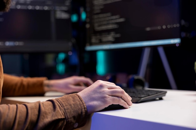 Freelancing cybersecurity admin using computer to prevent cyber attacks
