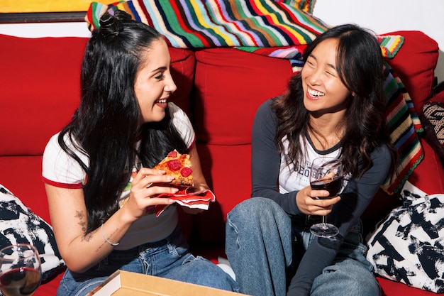 high angle friends eating pizza