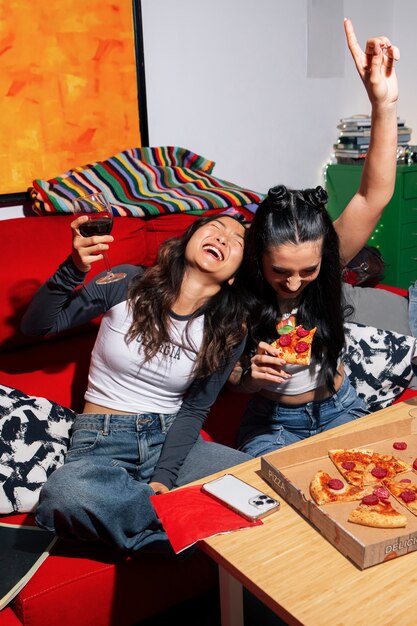 high angle friends eating pizza