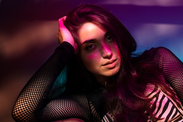portrait of person attending a vibrant techno music party