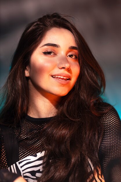 portrait of person attending a vibrant techno music party