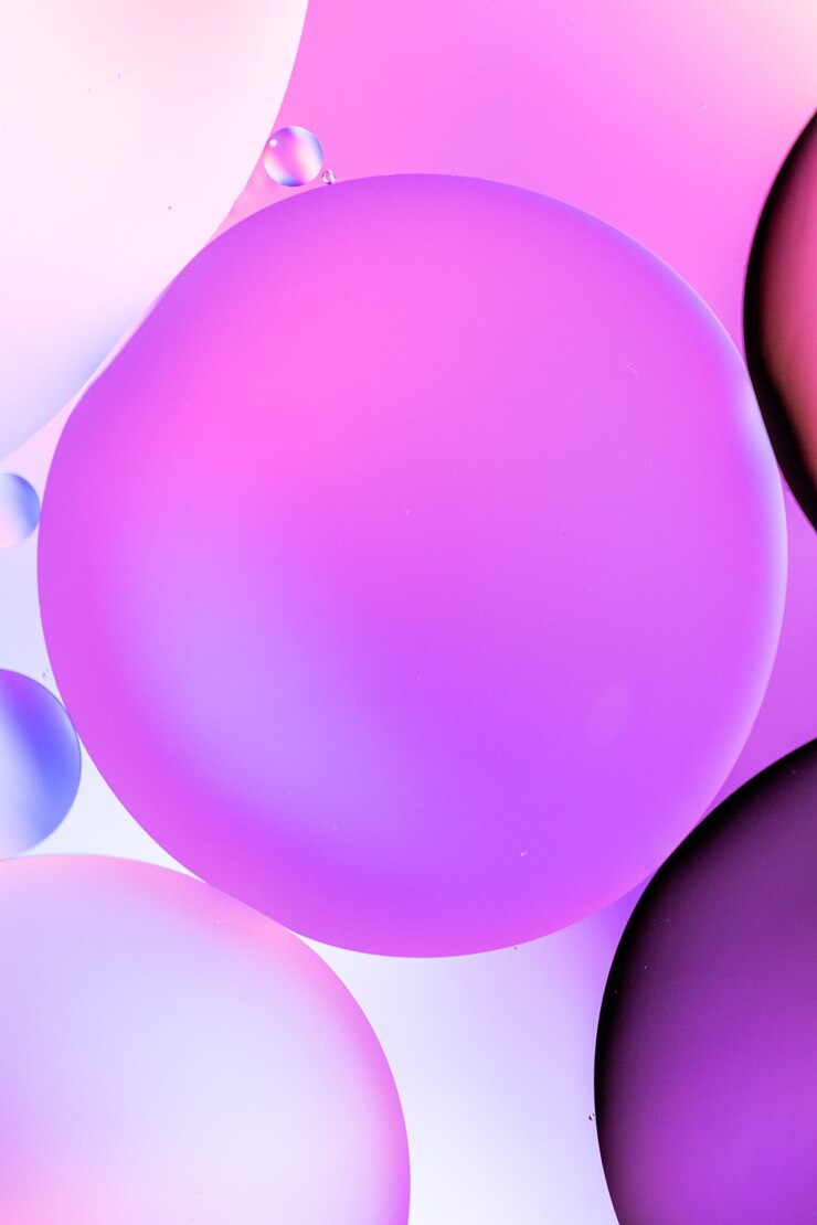 Gratis Bild vertical graphic illustration of circles filled with different shades of pink on a pink background