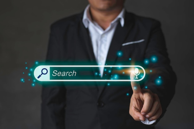 a business man touch searching bar blue search computer graphic light technology and internet online concept