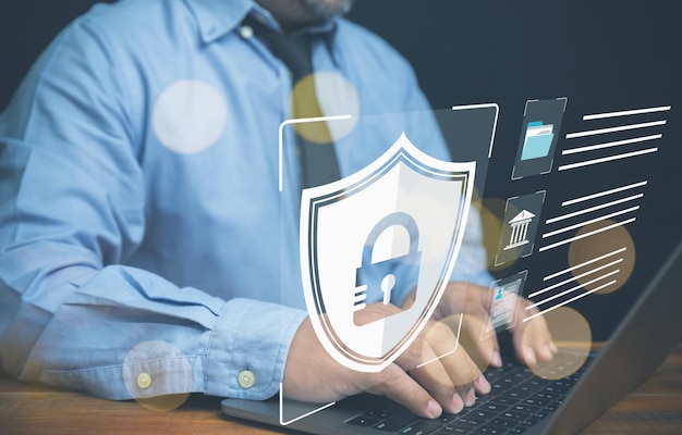 A businessman uses computer privacy security and protection against identity theft access In the future protect identity theft from cyber world internet security technology cybersecurity concept