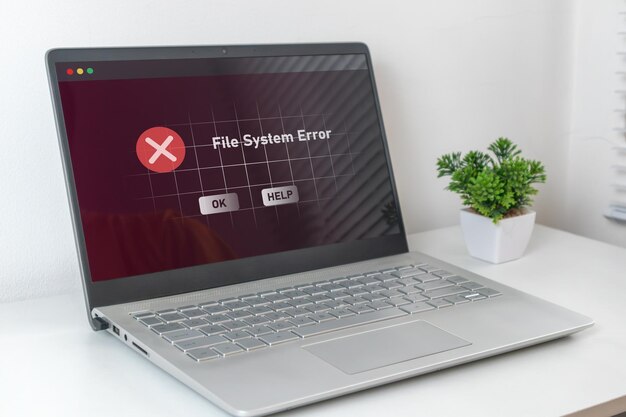 A computer laptop with operation error message System error file system error or critical error