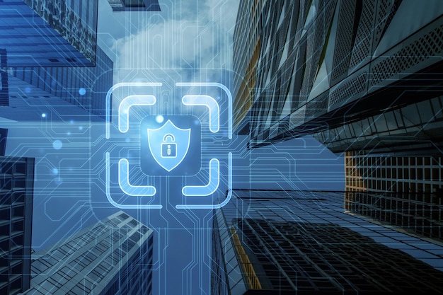 A double exposure image of skyscrapers with a digital hologram of a security concept on the blueprintstyle background
