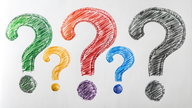 a drawing of question marks on a paper with colored markers
