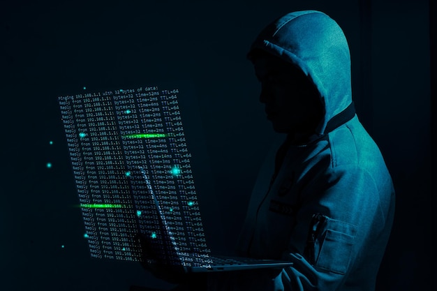 A hacker man using laptop for ping of death double exposure computer graphic light internet online attack code concept server and firewall protect system