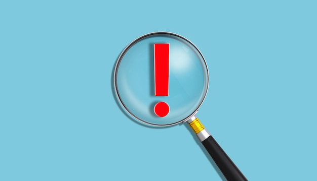 A magnifying glass with a red exclamation point on it