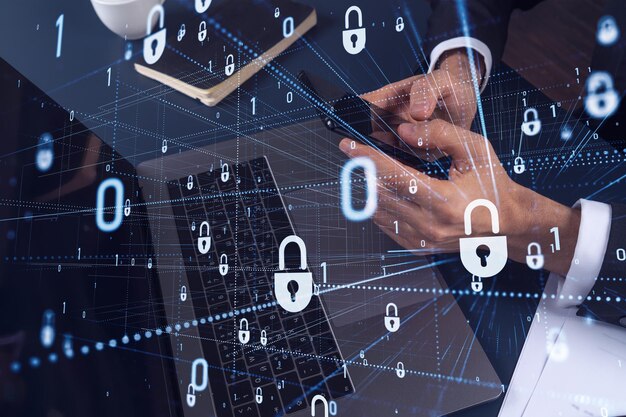 A programmer is browsing the Internet in smart phone to protect a cyber security from hacker attacks and save clients confidential data Padlock Hologram icons over the typing hands Formal wear