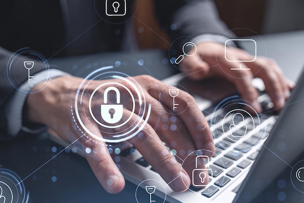 A programmer is typing a code on computer to protect a cyber security from hacker attacks and save clients confidential data Padlock Hologram icons over the typing hands Formal wear