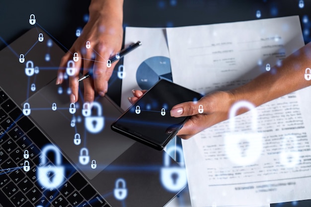 A woman programmer is typing a code on computer to protect a cyber security from hacker attacks and save clients confidential data Padlock Hologram icons over the typing hands Casual wear