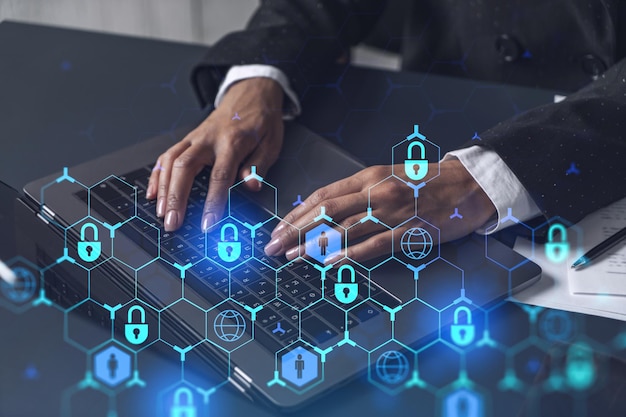 A woman programmer is typing a code on computer to protect a cyber security from hacker attacks and save clients confidential data Padlock Hologram icons over the typing hands Formal wear