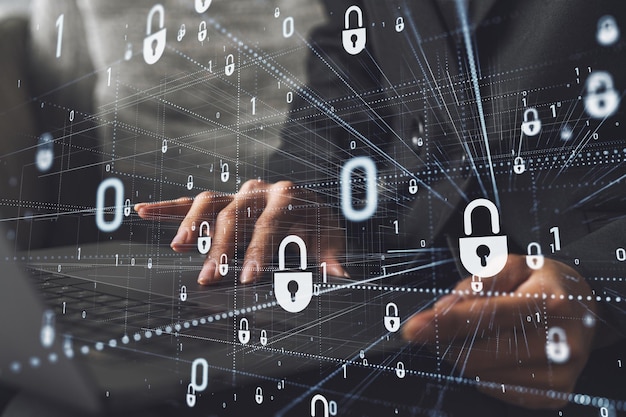 A woman programmer is typing a code on computer to protect a cyber security from hacker attacks and save clients confidential data Padlock Hologram icons over the typing hands Formal wear