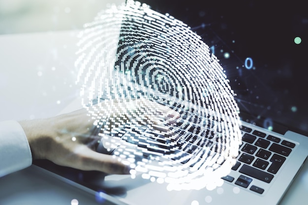 Abstract creative fingerprint concept with hands typing on laptop on background Multiexposure